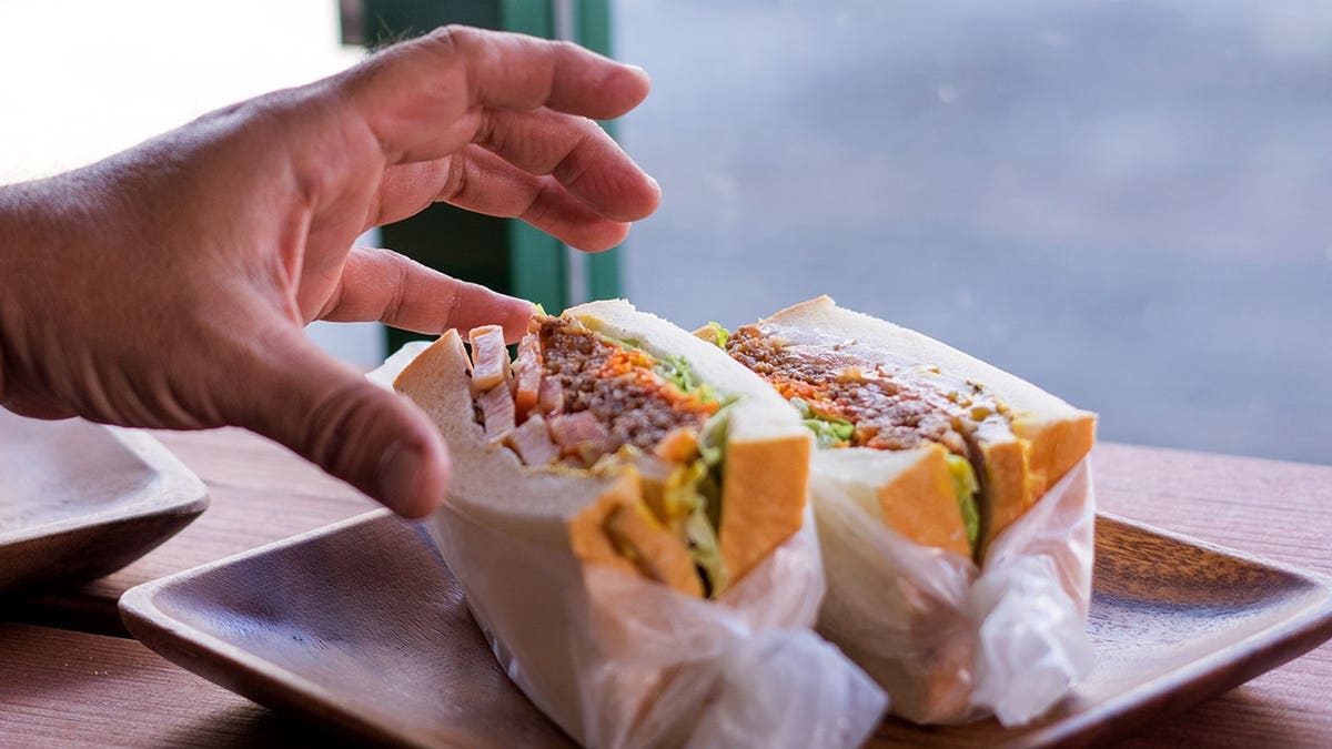 A sandwich served on a plate at a cafe in Okinawa