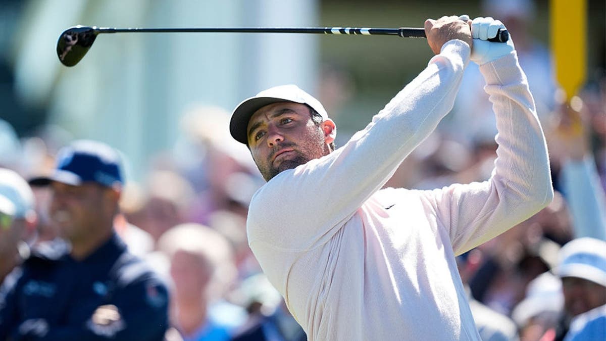 Scottie Scheffler hits his tee shot