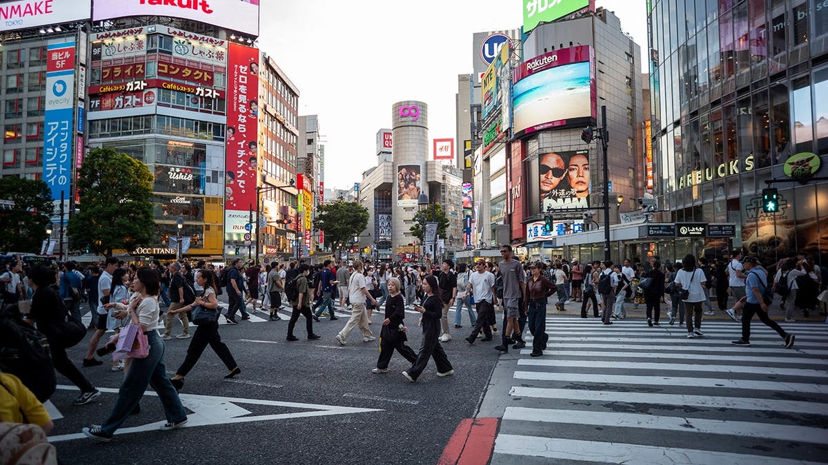Pedestrians crossing Shibuya Crossing in Tokyo, Japan