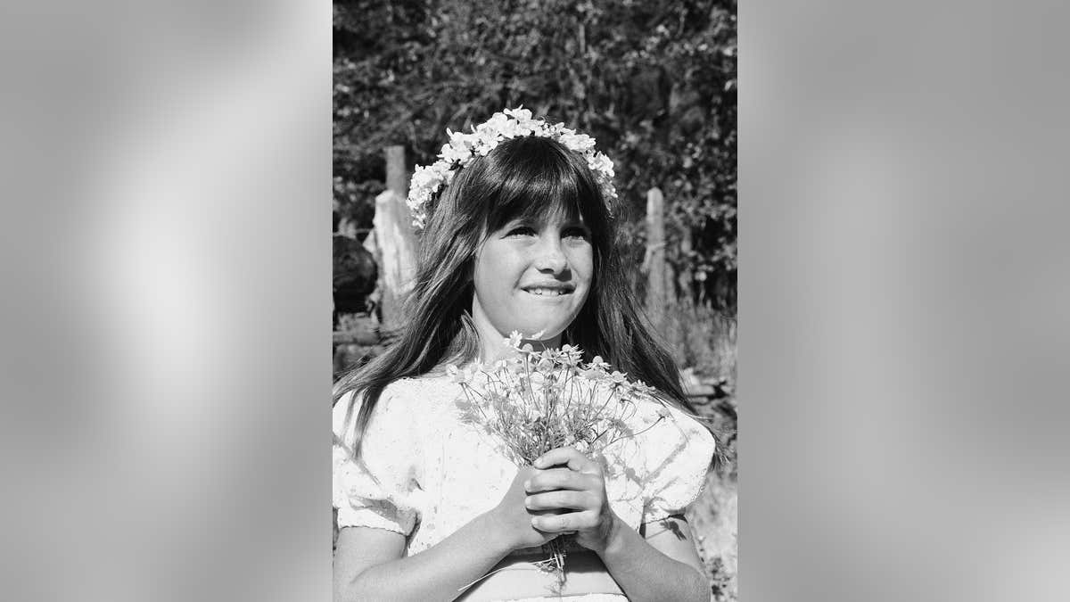 Sidney Greenbush portraying Alyssa standing in a scene from Little House on the Prairie