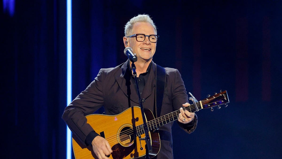Steven Curtis Chapman performing onstage at the Ryman Auditorium in Nashville, Tennessee