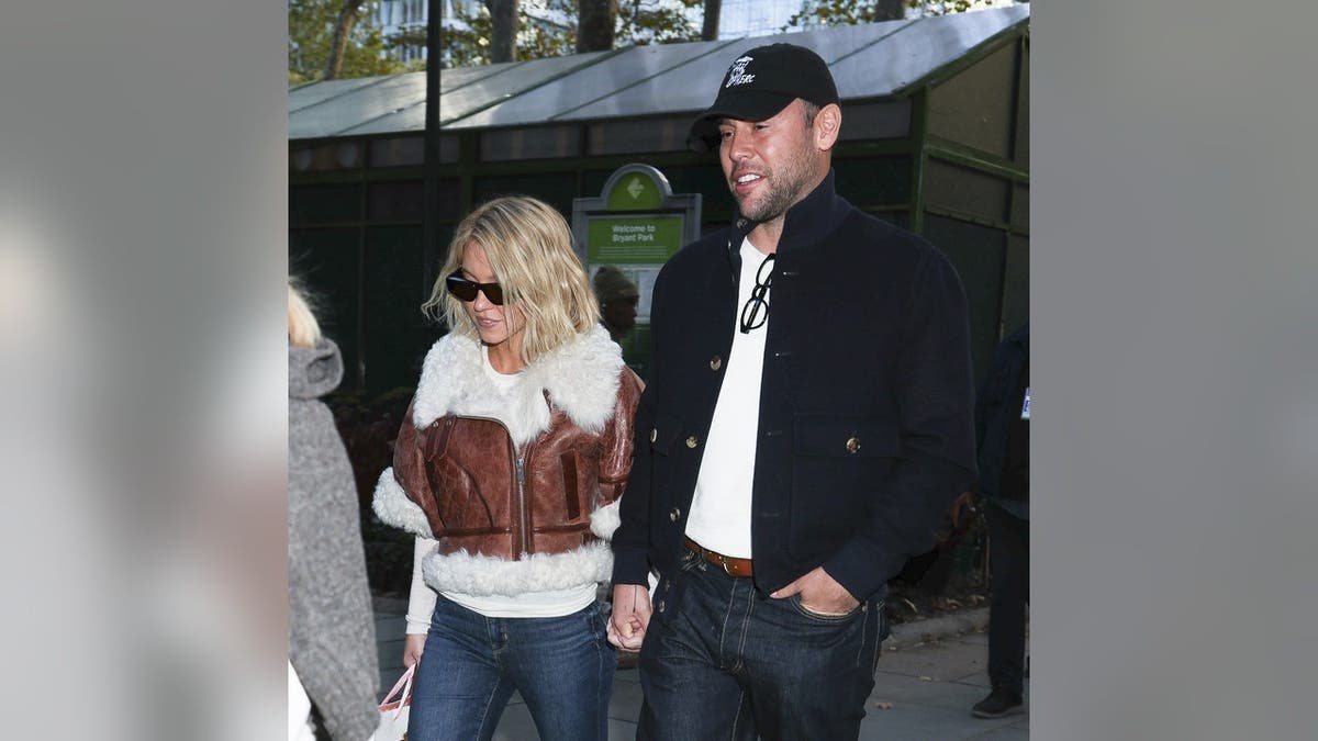 Sydney Sweeney and Scooter Braun stand together in Bryant Park in New York City