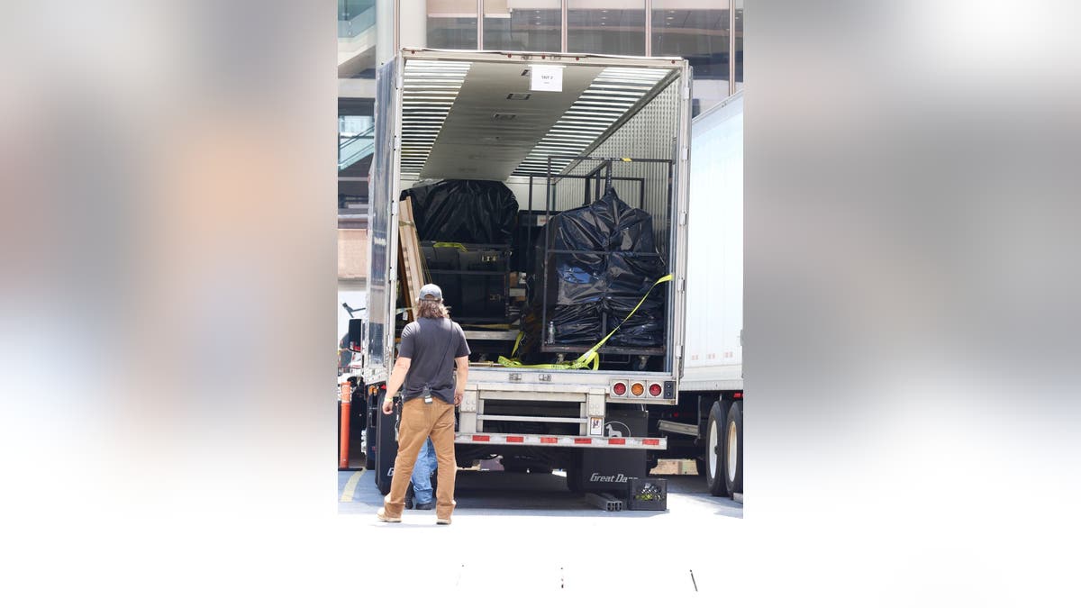 Taylor Swift wedding preparations with equipment and grass being loaded at Madison Square Garden in New York City
