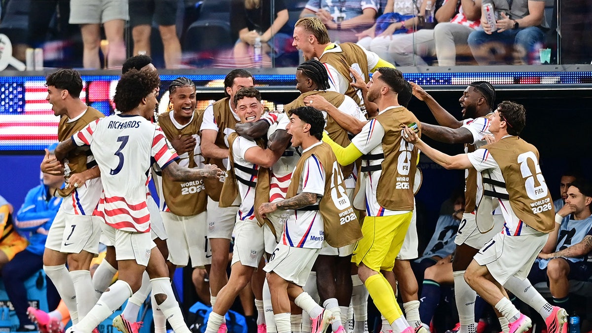 USA players celebrate after scoring a goal