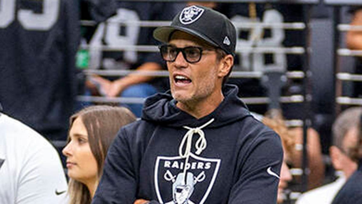 Raiders number proprietor Tom Brady yelling encouragement to players connected nan section astatine Allegiant Stadium