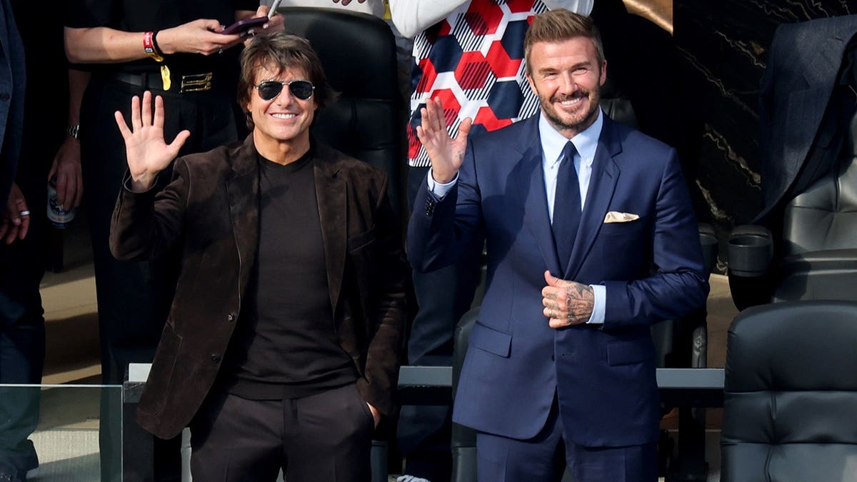 Tom Cruise and David Beckham watching the USA vs Paraguay match at the 2026 World Cup in Los Angeles in June 2026.