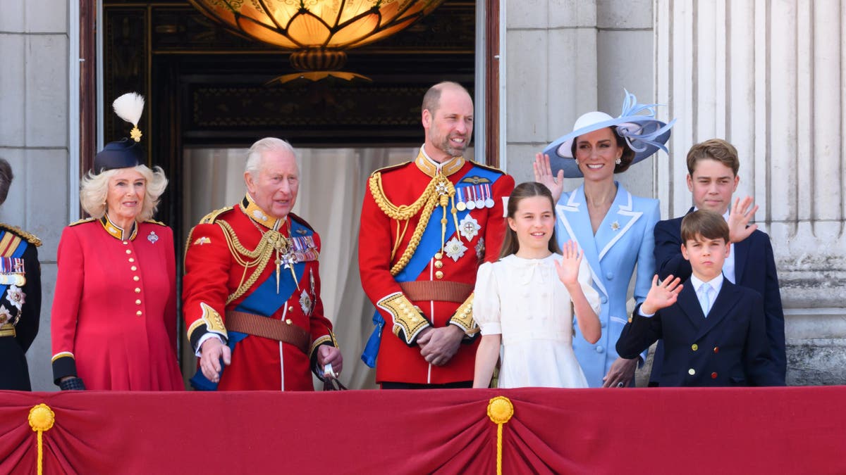 King Charles III, Queen Camilla, Prince William, Princess Charlotte, Catherine, Prince George, and Prince Louis standing during Trooping The Colour parade in London