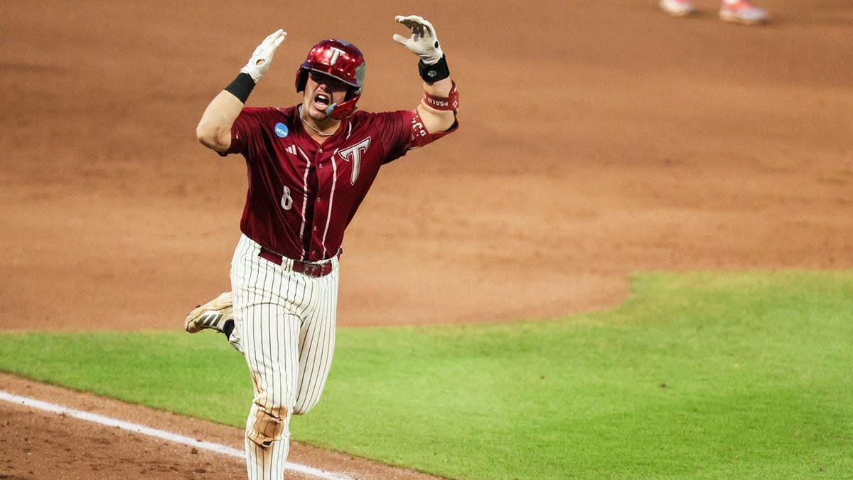 Troy catcher Jabe Boroff celebrating a home run at Condron Family Ballpark in Gainesville