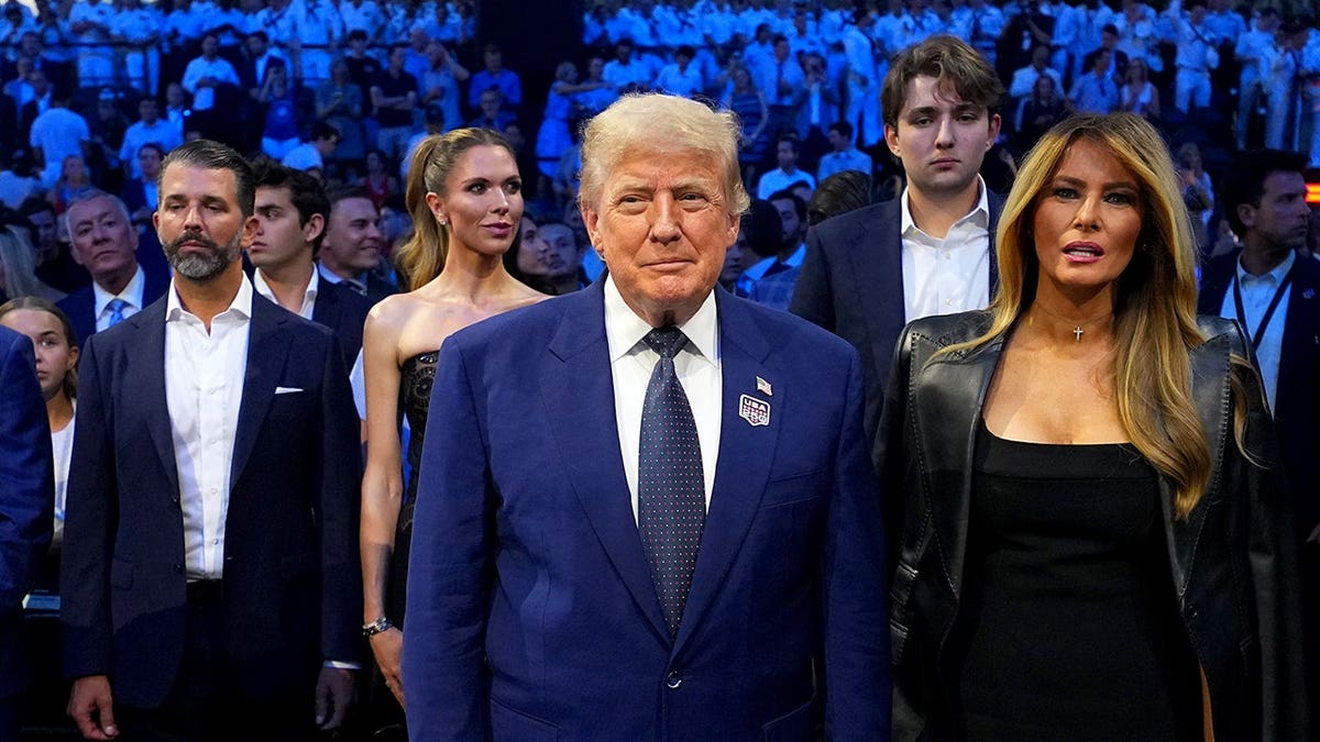 U.S. President Donald J. Trump and First Lady Melania Trump standing on the South Lawn at the White House.