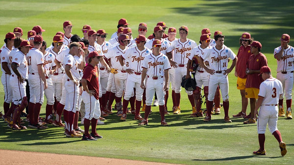 USC Trojans baseball players standing on field at Boshamer Stadium in Chapel Hill