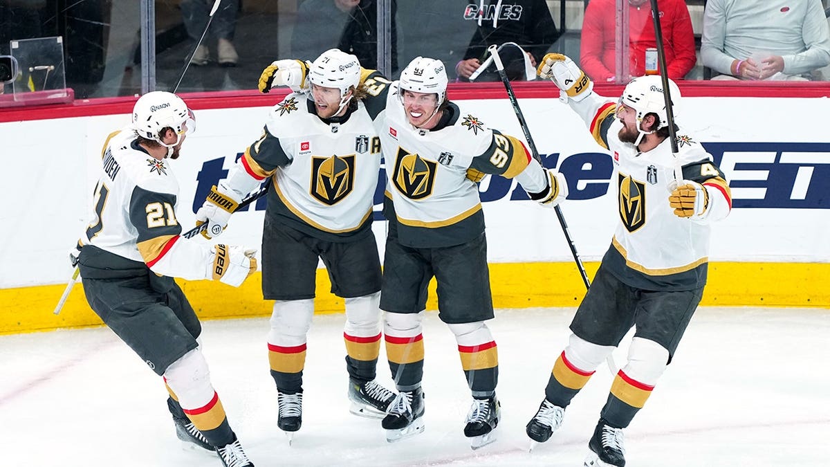 William Karlsson of the Vegas Golden Knights celebrates a goal with teammates on ice.