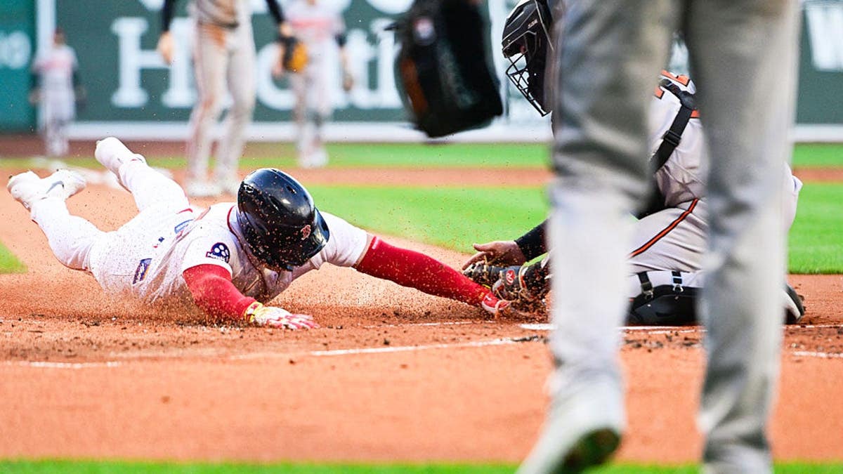Wilyer Abreu tagged out by Adley Rutschman at Fenway Park