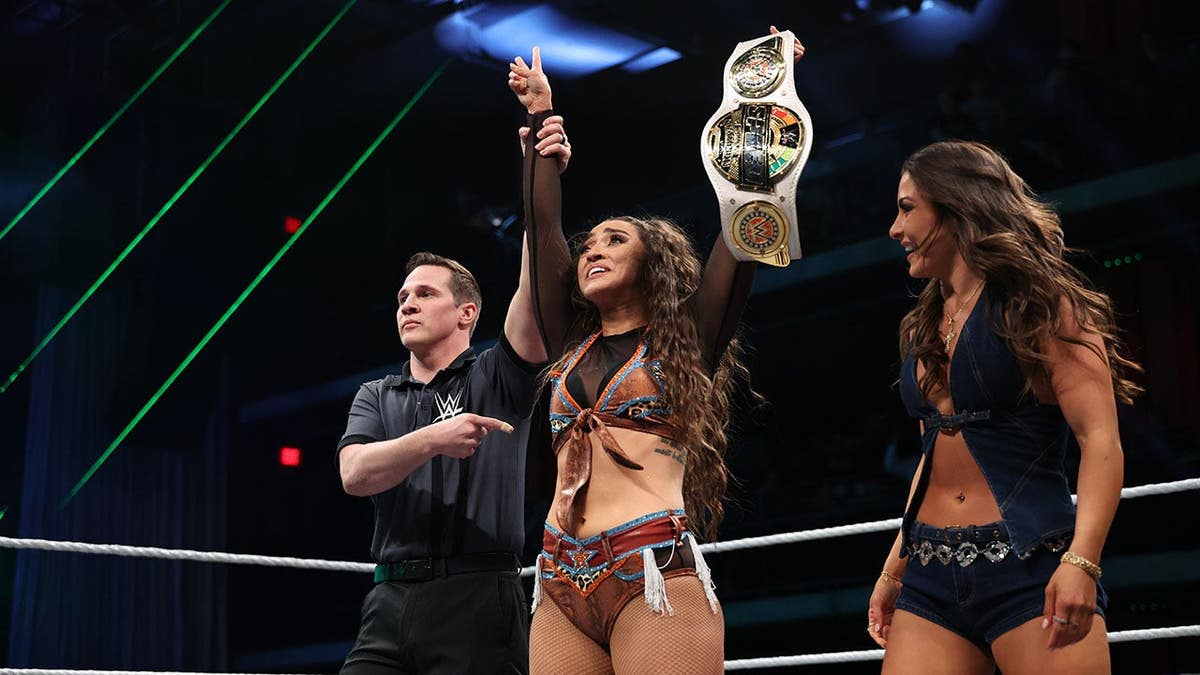 Wren Sinclair holding WWE Women's Speed Championship loop successful Houston venue.