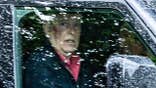 Former Prince Andrew looking shocked in his car with a bruise.