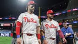 Bryce Harper and Kyle Schwarber walking off the field after a game
