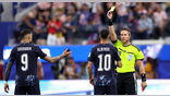 Referee Danny Makkelie shows a yellow card to Miguel Almiron #10 of Paraguay after a VAR check for 'mistaken identify'