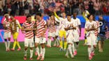 U.S. men's national team players celebrate after a soccer match