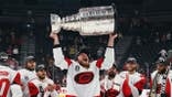 Andrei Svechnikov holding the Stanley Cup at T-Mobile Arena in Las Vegas