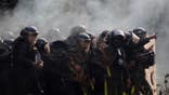 Police officers firing tear gas at community members at Humberto Suarez oil facility in Bolivia