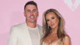 Brooks Koepka and Jena Sims standing together at the Victoria's Secret Fashion Show