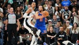 New York Knicks All-Star Jalen Brunson looks to pass while being defended by San Antonio Spurs big Victor Wembanyama in Game 2 of the 2026 NBA Finals at Frost Bank Center in Texas.