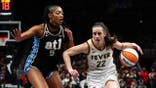 Caitlin Clark driving to the basket against Angel Reese at State Farm Arena in Atlanta