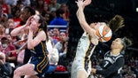 Caitlin Clark attempting a shot while being fouled during a basketball game.