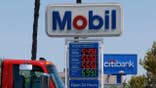 Gas prices displayed on a sign at a Mobil gas station in Los Angeles, California.