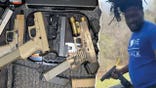 A screenshot ofAnthony Edmond, also known as "Chapo," along with weapons he was reportedly brokering for sale