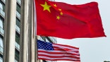 Chinese and US flags fly in Hong Kong