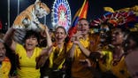 Supporters of De la Espriella holding a stuffed tiger during an election rally for their candidate.