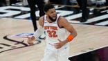 New York Knicks center Karl-Anthony Towns looking for a call during NBA Finals game.