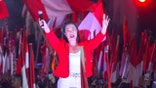 Keiko Fujimori waving to supporters during a campaign rally in Lima