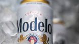 A Modelo beer can is seen on ice.
