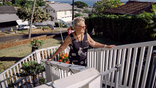 Sandra May on her porch steps