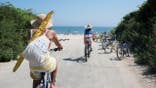Bicycles and sandals resting on sand at Gibson Beach in Bridgehampton