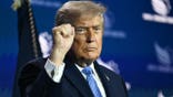 trump pumps fist in air at  Faith & Freedom Coalition