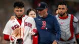 Willson Contreras reacts with interim bench coach José David Flores after fourth-inning ejection versus Nationals. (Photo by Maddie Malhotra/Boston Red Sox/Getty Images)
