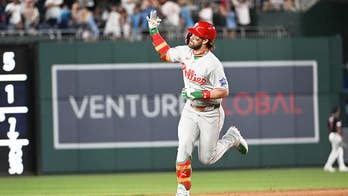 Bryce Harper responds to vulgar chants from National fans with a home run and a gesture during his trot