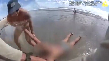 Florida deputy drags 'unresponsive' beachgoer from ocean in dramatic rescue