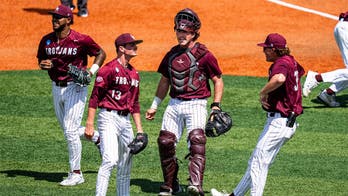 Little Rock baseball team celebrates with bus driver on the field after upset win to advance to Super Regional