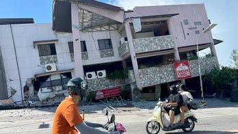 A 7.8 magnitude quake in the Philippines kills at least 32, collapses buildings and sparks tsunami