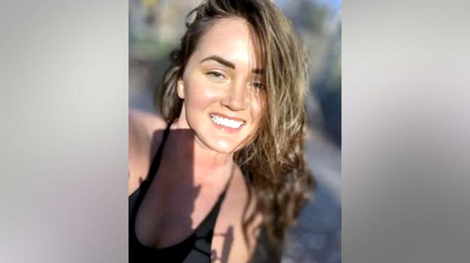 Elena Katherine Moore smiling in a photo