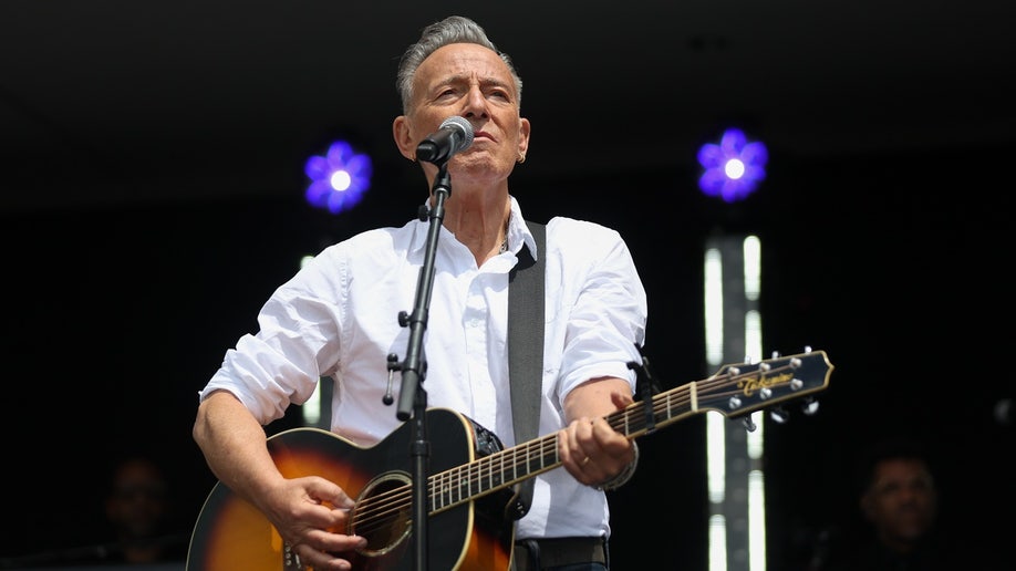 Bruce Springsteen plays guitar