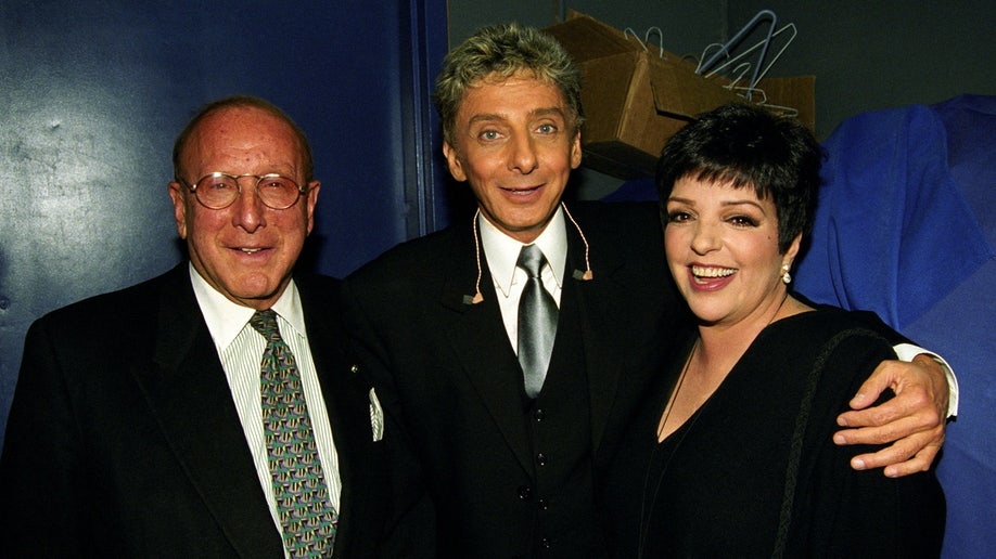 Clive Davis poses with Barry Manilow and Liza Minelli