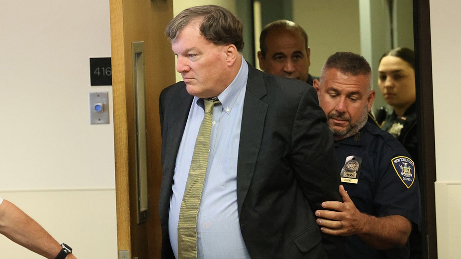 Rex Heuermann escorted into a courtroom at Suffolk County Court.