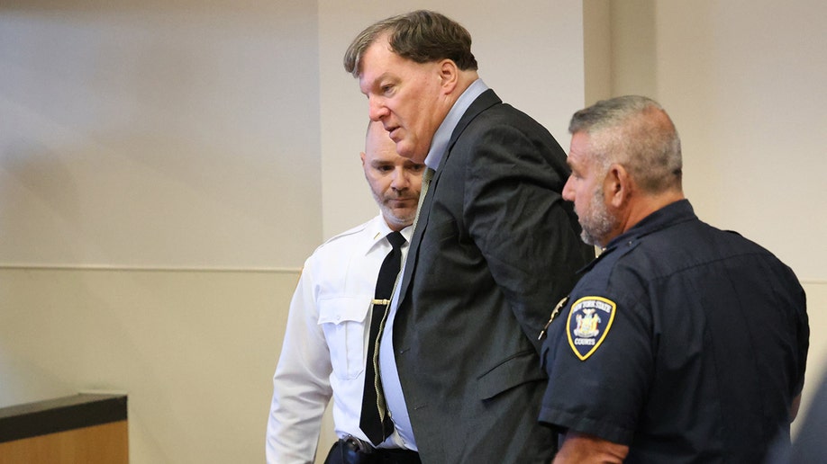 Rex Heuermann escorted into a courtroom at Suffolk County Court.