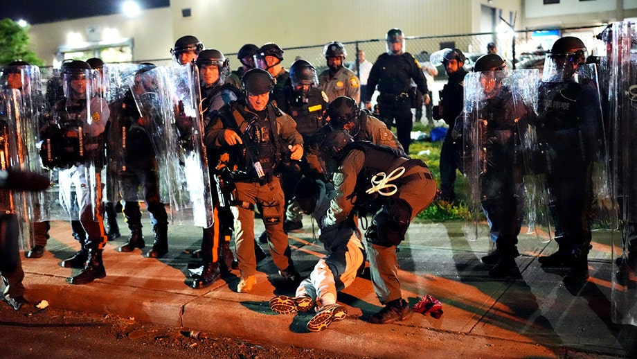Agitators cuffed after tense curfew standoff with state police at NJ ICE detention site
