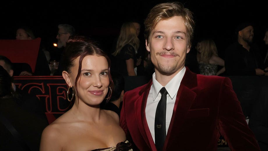 Millie Bobby Brown defends husband Jake Bongiovi after critics blast him for not helping with their bags