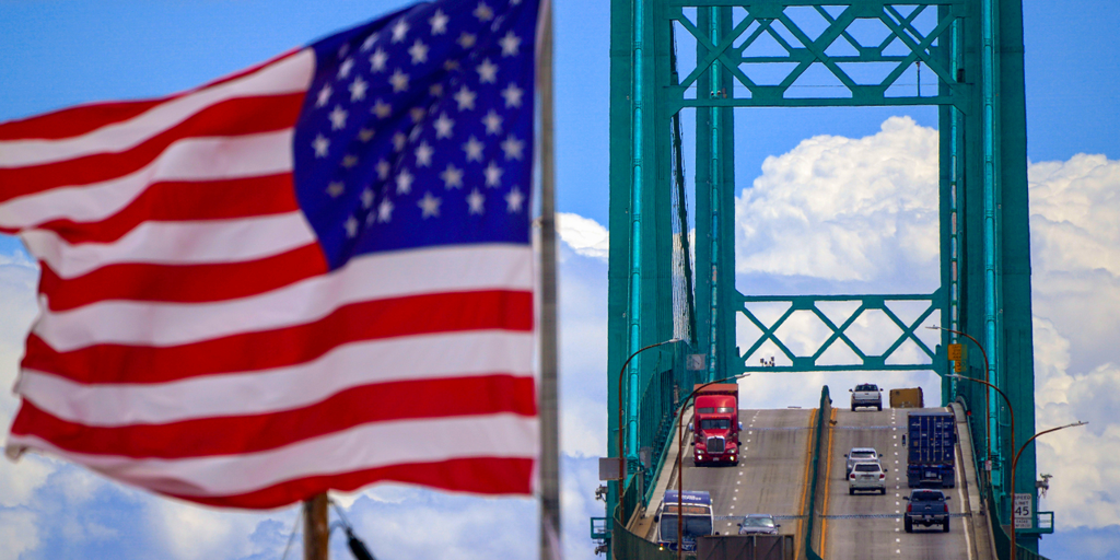 american flag semi trucks highway